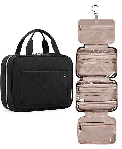 Black quilted travel toiletry bag with multiple zippered compartments and hanging hook opened to show interior storage.