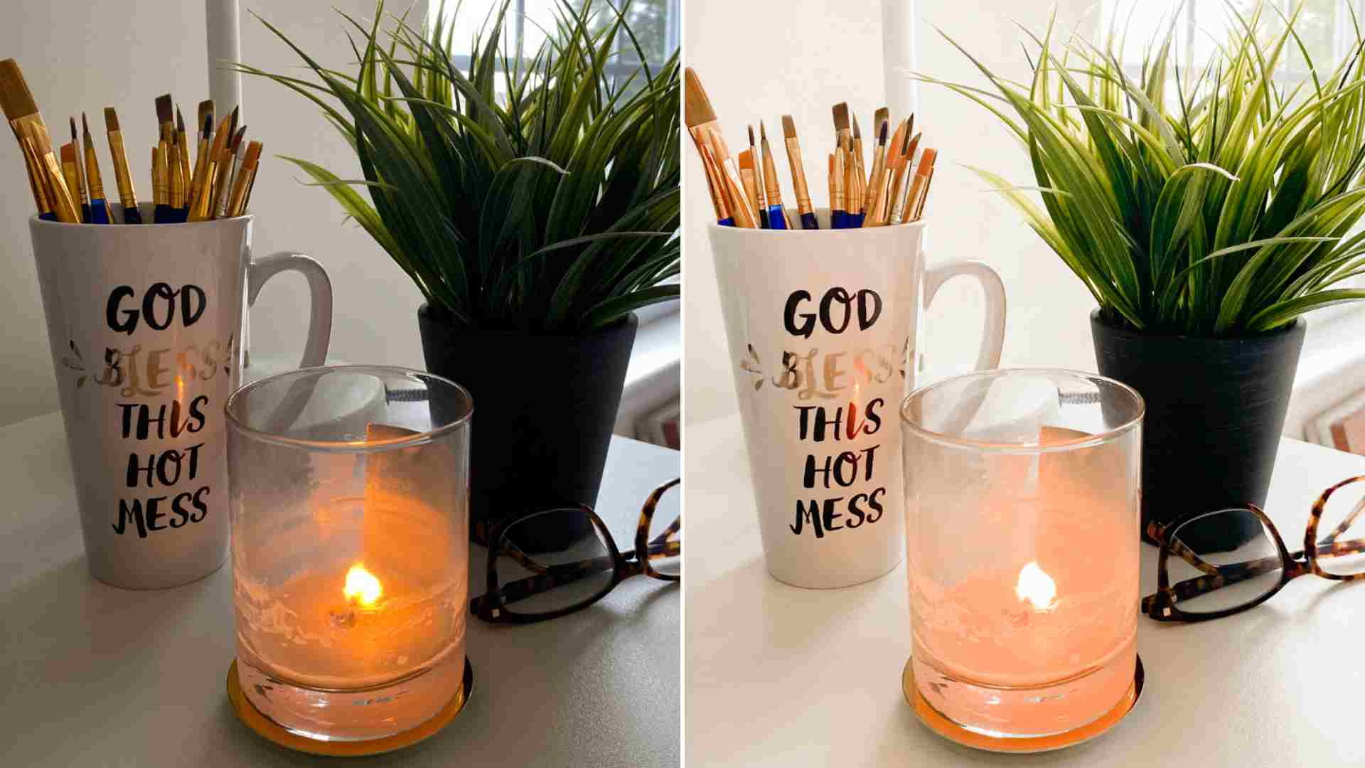 Desk setup with candle, mug of paintbrushes that reads “God Bless This Hot Mess,” and a small green plant.