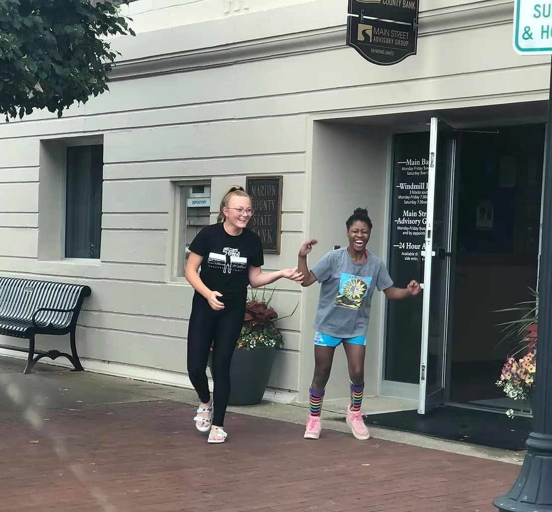 Two people exiting Marion County State Bank
